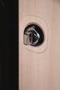 Close up of stylish silver chrome door handle on modern interior door. Stylish light brown door with frosted glass Royalty Free Stock Photo