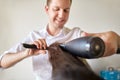 close up of stylist making hairdo at salon Royalty Free Stock Photo