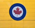 Close-up of  stylized red maple leaf in a white circle bordered by blue, insignia of the RCAF. Royalty Free Stock Photo