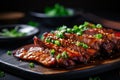 Close up of succulent and juicy roasted barbecue pork ribs with mouthwatering slices of tender meat