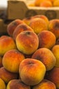 Close up of many peaches stacked at market Royalty Free Stock Photo