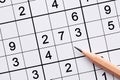 Close up sudoku puzzle game and pencil