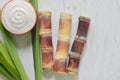 Close up sugar cane on rustic wood table.Brown sugar and cane on wood background.Cane top view.Cane .