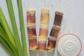 Close up sugar cane on rustic wood table.Brown sugar and cane on wood background.Cane top view.Cane . Royalty Free Stock Photo