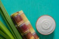 Close up sugar cane on rustic wood table.Brown sugar and cane on wood background.Cane top view.Cane .