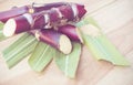 Close up sugar cane on rustic wood table.Brown sugar and cane on wood background.Cane top view.Cane .