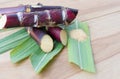 Close up sugar cane on rustic wood table.Brown sugar and cane on wood background.Cane top view.Cane .