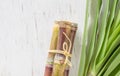 Close up sugar cane on rustic wood table.Brown sugar and cane on wood background.Cane top view.Cane .