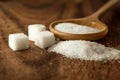 Close up sugar cubes and cane in wooden spoon on the table Royalty Free Stock Photo