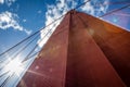 Close up with a sunburst on the left looking up at the north tower of the Golden Gate Bridge Royalty Free Stock Photo