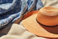 A close-up of a sunhat and beach towel in the sun