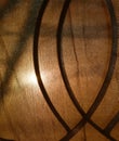 Sunlight through old curtain and wrought iron curve on window frame Royalty Free Stock Photo