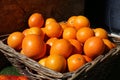 A juicy background of tasty oranges in the basket