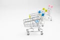 Close up of supermarket grocery push cart for shopping with black wheels on white background. Concept of shopping. Royalty Free Stock Photo