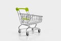 Close up of supermarket grocery push cart for shopping with black wheels on white background. Concept of shopping. Royalty Free Stock Photo