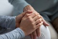 Close up of supportive mom and adult daughter holding hands Royalty Free Stock Photo