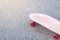 Close Up surf skate pink or skateboard on a skate park extreme sports. Concept family activity lifestyle of the new generation for
