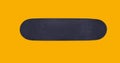 Close up surface black skateboard isolated on yellow background, flat lay, top view