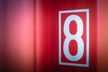 Close up surface texture of the Red container with eight number. Vintage background concept. Free space for text