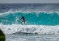 CLOSE UP: Surfer rides a big glassy wave breaking towards a tropical island Royalty Free Stock Photo