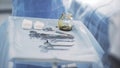 Close up of surgical table with instruments. Action. Medical sterile tools lying on a table with an iodine bowl, concept Royalty Free Stock Photo