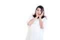 Surprised pregnant woman in white dress