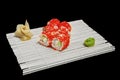 Close-up of sushi and rolls in the restaurant kitchen. Japanese traditional cuisine. California sushi rolls on bamboo backing Royalty Free Stock Photo