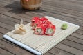 Close-up of sushi and rolls in the restaurant kitchen. Japanese traditional cuisine. California sushi rolls on bamboo backing on Royalty Free Stock Photo