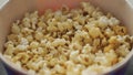 Close-up of sweet popcorn in bucket. Media. Delicious sweet popcorn for watching movies in cinema. Sweet snack at cinema