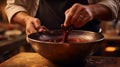 A close-up of a Swiss chocolatier's hand tempering a bowl of molten chocolate, capturing the glossy, velvety texture