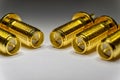 Close-up of symmetric aligned gold plated SMA male connectors electronics components in partial focus white background