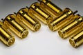 Close-up of symmetric aligned gold plated SMA male connectors electronics components in partial focus white background