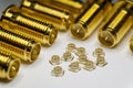 Close-up of symmetric aligned gold plated uFL micro precision radio connector in partial focus white and SMA background