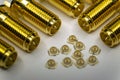 Close-up of symmetric aligned gold plated uFL micro precision radio connector in partial focus white and SMA background