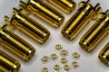 Close-up of symmetric aligned gold plated uFL micro precision radio connector in partial focus white and SMA background