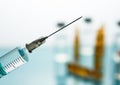 Close up Syringe needle medicine with liquid medicine drop Royalty Free Stock Photo