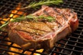 close-up of a t-bone steak grilling, showing texture and juiciness