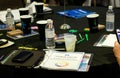 close up of table with binder, notes, water worksheets at a business convention event