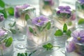 A close up of a table with a bunch of ice cubes and flowers. edible flower Royalty Free Stock Photo