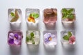 A close up of a table with a bunch of ice cubes and flowers. edible flower Royalty Free Stock Photo