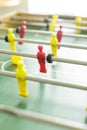 Close up of table football. Red and yellow table soccer players Royalty Free Stock Photo