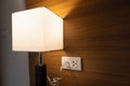 Close Up table lamp electrical power socket and plug socket on wall Royalty Free Stock Photo