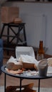 Close up of table with leftover on it in empty unorganized messy living room Royalty Free Stock Photo