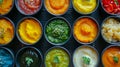 A close up of a table with many bowls filled with different colored sauces, AI