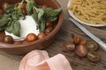 Italian pasta preparation with cherry tomatoes, cheese and fresh basil leaves Royalty Free Stock Photo