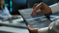 Close up of tablet used by IT worker doing maintenance on server farm gear Royalty Free Stock Photo