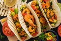 Close up tacos with shrimp. Mexican traditional snack. View from above.