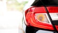 Close up tail light of black car. Royalty Free Stock Photo