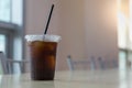 Close up of take away plastic cup of iced black coffee Americano on table with copy sapce Royalty Free Stock Photo