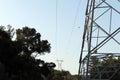 A concrete electric pole with steel cables in blue sky